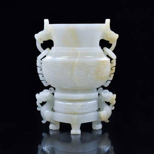 JADE ZUN VASE: Dimensions: 180.975mm H x 142.74mm W Weight: 981.4g A superb, carved Chinese jade Zun vase. Of baluster body, raised on slight tripod splayed foot base. The wide prominent neck raised tall trumpet