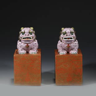 PAIR FAMILLE ROSE PORCELAIN CHOP SEALS: Dimensions: Length: 8.7cm, Width: 8.7cm, Height: 18.4cm Pair Of Chinese Qing Dynasty Famille Rose Fu Dog Porcelain Seals. Potted to a smooth surface with a imperial dragon look forward handgrip