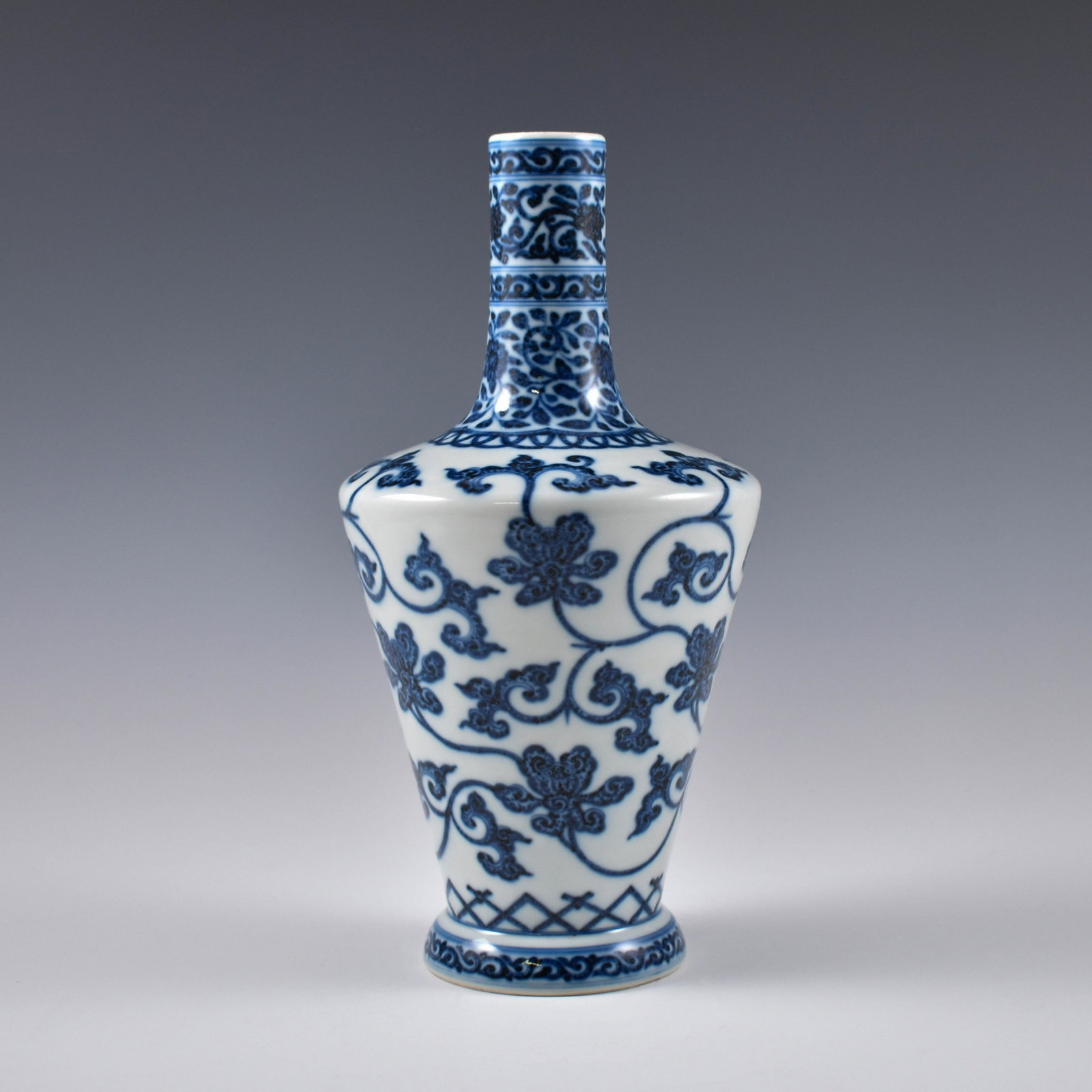 YONGZHENG BLUE & WHITE SCROLLING FLORAL VASE: PROVENANCE: From Private collections of Mr. Peter Lyon (1938-2016), After graduation in 1959 he joined the military and was trained as a fighter pilot for the Marine corp. Retiring from the military h