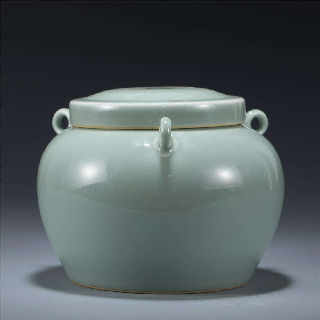 MING YONGLE BEAN GREEN JAR: Dimensions: Length: 16 cm, Width: 16 cm, Height: 12.7 cm Chinese Ming Dynasty Yongle Bean Green Porcelain Jar. Potted with a large cylinder vessel, having thick and tall potted body and sturdily, emer