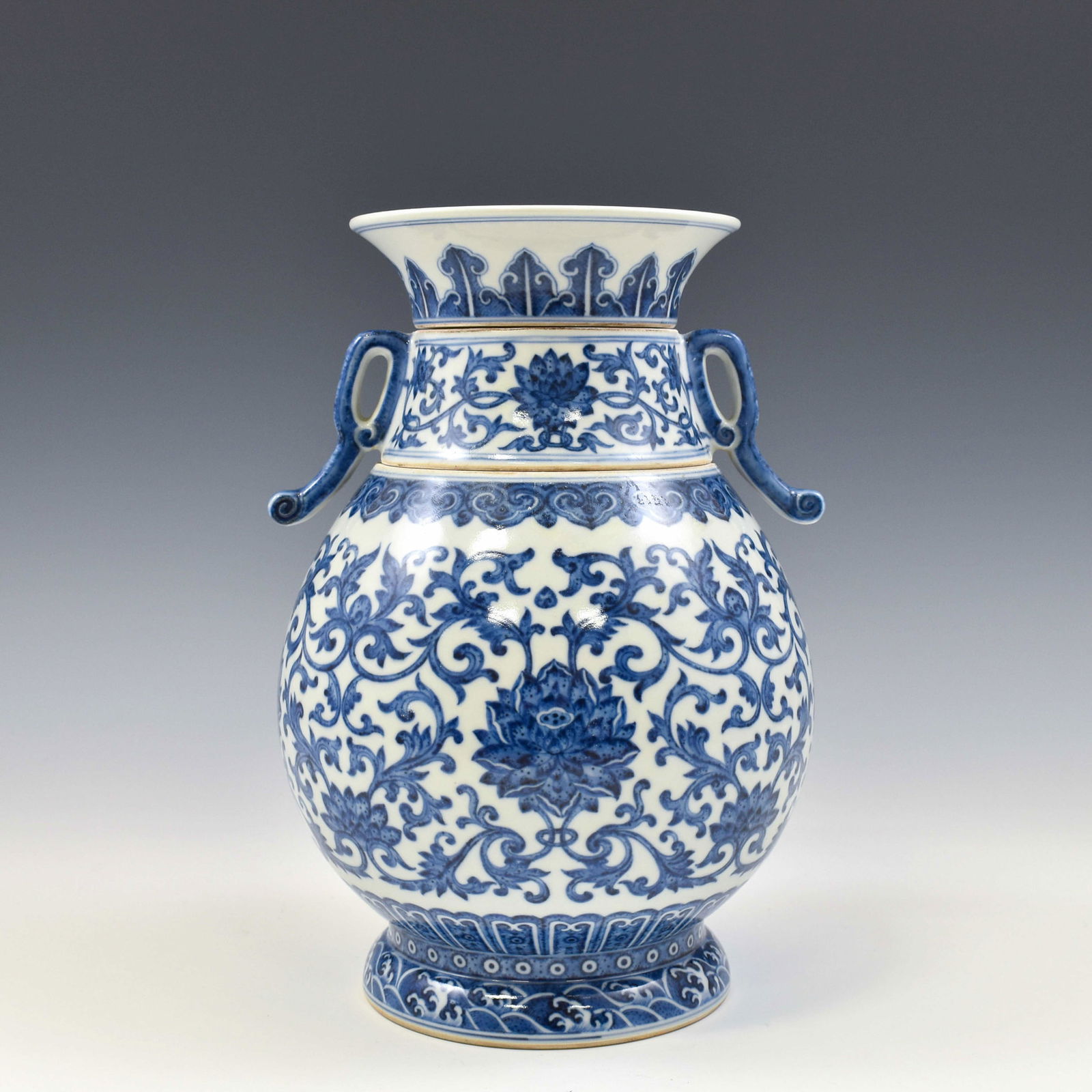 QIANLONG BLUE & WHITE WRAPPED FLORAL ZUN AMPHORA VASE: Dimensions: 7.875"W x 10.75"H Chinese Qing Dynasty Period, Qianlong blue & white wrapped floral motif porcelain zun amphora vase. The Porcelain potted in a Zun Amphora shaped vase, thick and large, gl