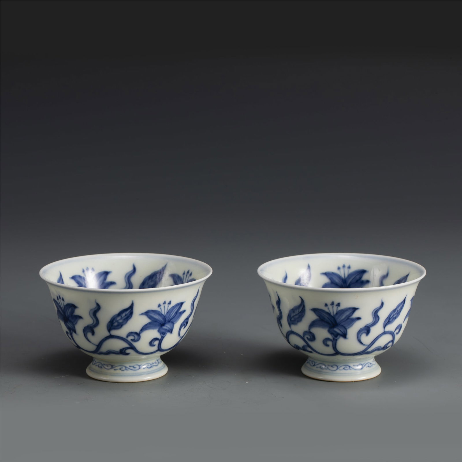 PAIR OF MING CHENGHUA BLUE & WHITE FLOWER BOWLS: Dimensions: Width: 8.9cm, Height: 5.4cm. Pair of Chinese Ming Dynasty Chenghua Blue and White Flower Bowls. Potted with a shallow body, slight deep, thick and bulbous body, with angled cavetto elevate