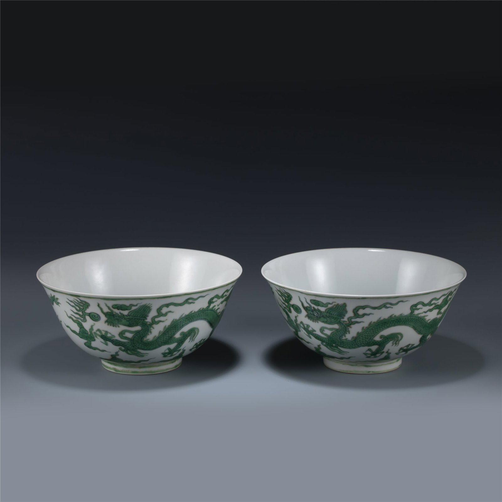 PAIR OF MING CHENGHUA GREEN DRAGON BOWLS: Dimensions: Length: 18.5 cm, Width: 18.5 cm, Height: 8.8 cm Pair of Chinese Ming Dynasty Chenghua Green Dragon Porcelain Bowl. The Bowl has a shallow body, slight deep, thick and bulbous body, with an