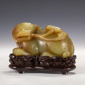 YELLOW JADE CARVED QILIN ON STAND