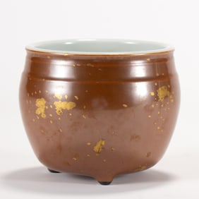 A CHINESE PERSIMMON GLAZED TRIPOD JAR