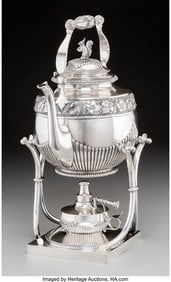 A KOCH & BERGFELD SILVER HOT WATER KETTLE ON STA