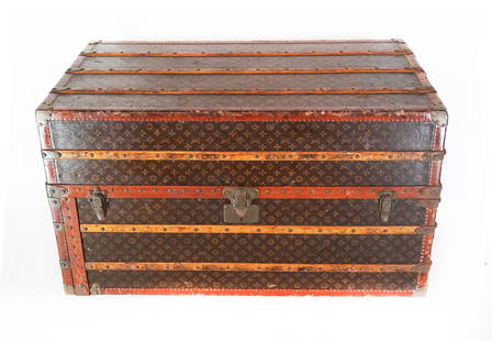 LOUIS VUITTON MONOGRAMMED STEAMER TRUNK: 19th century Louis Vuitton trunk, fitted with six drawers, pull-out rods, hangers, removable compartments. 24" H x 41" W x 22" D