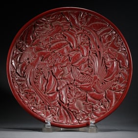 RED LACQUERWARE CARVED PLATE WITH FLORAL PATTERNS