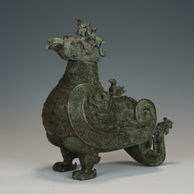 A BRONZE BIRD - SHAPED ZUN