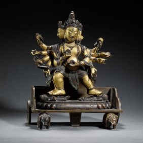 GILDED - BRONZE MULTI - FACED AND MULTI - ARMED DHARMAPALA STATUE
