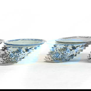 PAIR OF BLUE & WHITE BIRD & FLORAL PLANT POTS: Measurements: 9.25in x17.375in x 17.375in Chinese Qing Dynasty Period, JiaQing Wrapped rococo floral motif on blue ground porcelain porcelain plat pots. Potted with a shallow body, slight deep,