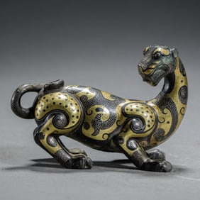 BRONZE MYTHICAL BEAST WITH INLAID GOLD AND SILVER