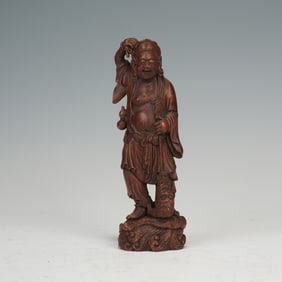 A WOODEN SCULPTURE OF LIU HAI AND GOLDEN TOAD