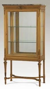19TH C. FRENCH MARBLE TOP VITRINE, 59"H: Late 19th century French Louis XVI style marble top vitrine, of carved and gilded wood, the beveled glass door with beaded edge opening to glass shelves in the lighted case with mirrored back, raised