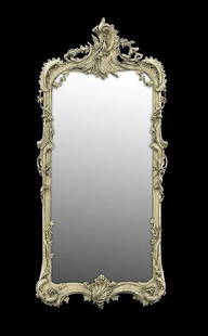 CONTINENTAL ROCOCO PAINT-DECORATED PIER MIRROR: Continental Rococo Paint-Decorated Pier Mirror third quarter 18th century, the carved frame decorated with rocaille ornament and pierced leaves, the volute-carved crest decorated with a metal sheaf