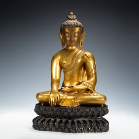 A GILDED BUDDHA STATUE