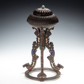 A WOODEN INCENSE BURNER