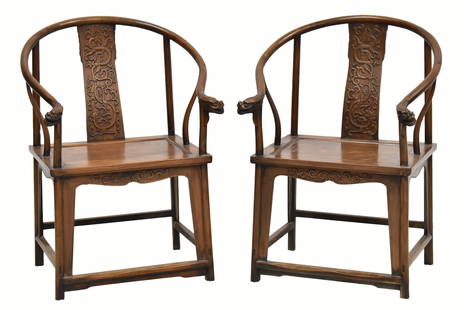 PAIR HUANGHUALI HORSESHOE BACK ARMCHAIRS: Measurements: Height: 38-1/2" Width: 26" Depth: 23-1/4"  Pair of Antique Chinese HuangHuaLi horseshoe back round arm chairs, QuanYi. Constructed with sweeping crest rail terminating in out swept hooks