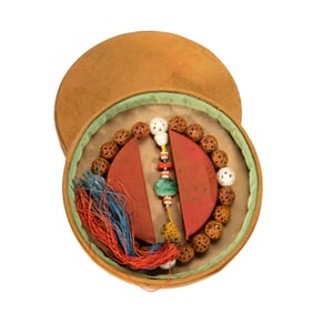 A CARVED - NUT BRACELET