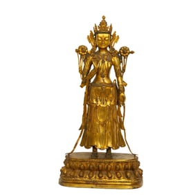 A GILT - BRONZE STATUE OF TARA