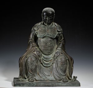 BRONZE STATUE OF SEATED FIGURE