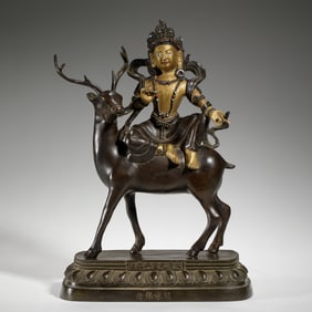 BRONZE STATUE OF DEITY RIDING DEER