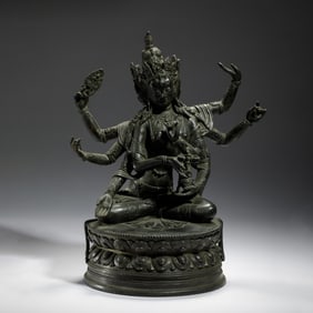 BRONZE STATUE OF MULTI - ARMED BUDDHIST DEITY