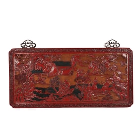 RED LACQUER CARVED PLAQUE WITH FIGURE AND LANDSCAPE SCENE