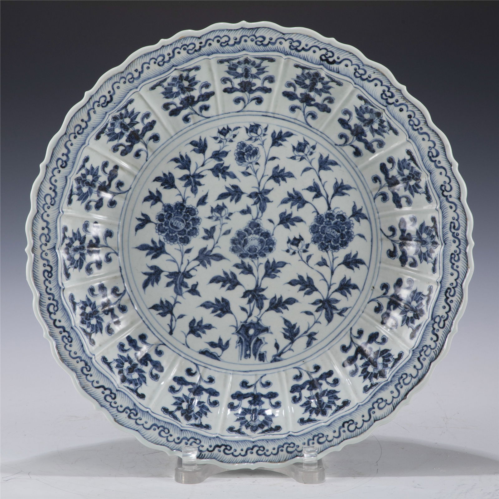 MING BLUE AND WHITE PLATE: Dimensions: Length: 45.6 cm, Width: 45.6 cm, Height: 7.5 cm Chinese Ming Dynasty Blue and White Flower Porcelain Plate. The plate has a broad wide central interior, rounded mouth lip, thick and large,