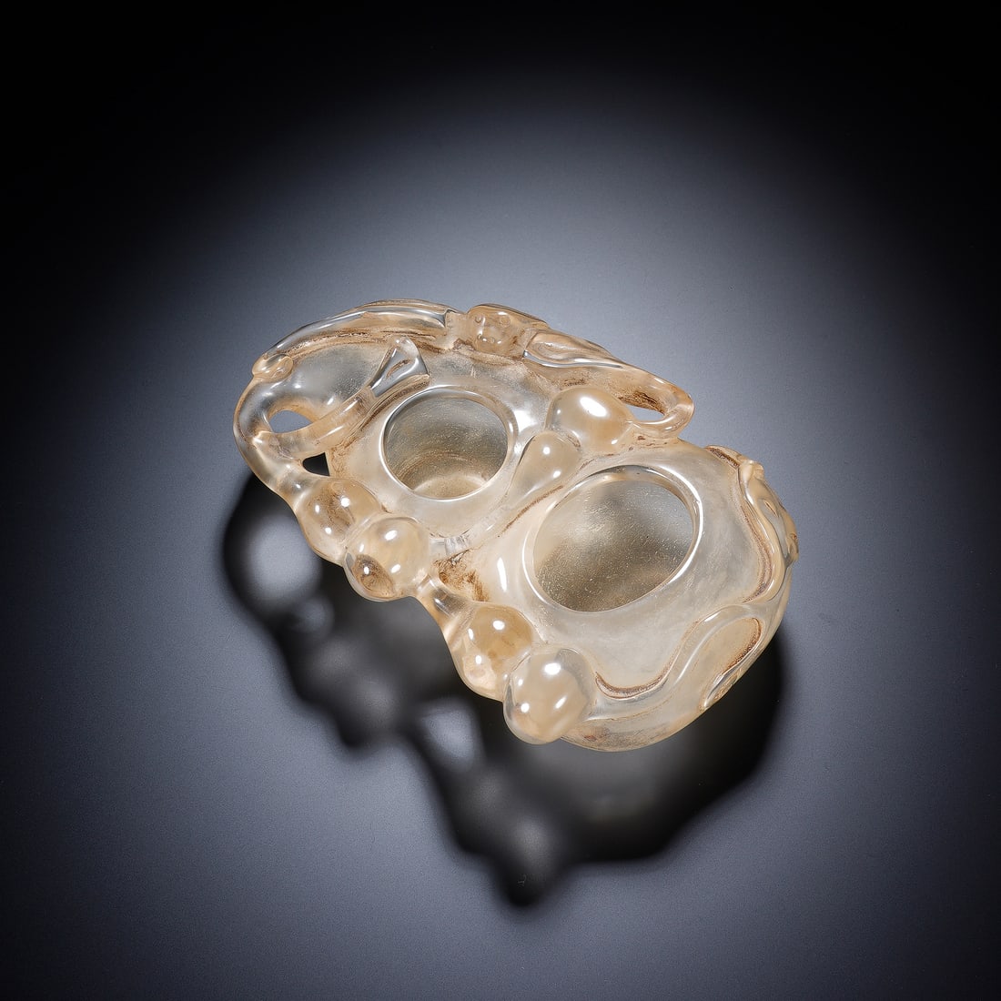 CHINESE ROCK CRYSTAL GOURD WASHER: Dimensions: 16x11x5 cm. Weight 649 grams. This elegant Chinese rock crystal washer is carved in a double-gourd form, a symbol of longevity and prosperity in Chinese culture. The translucent stone show