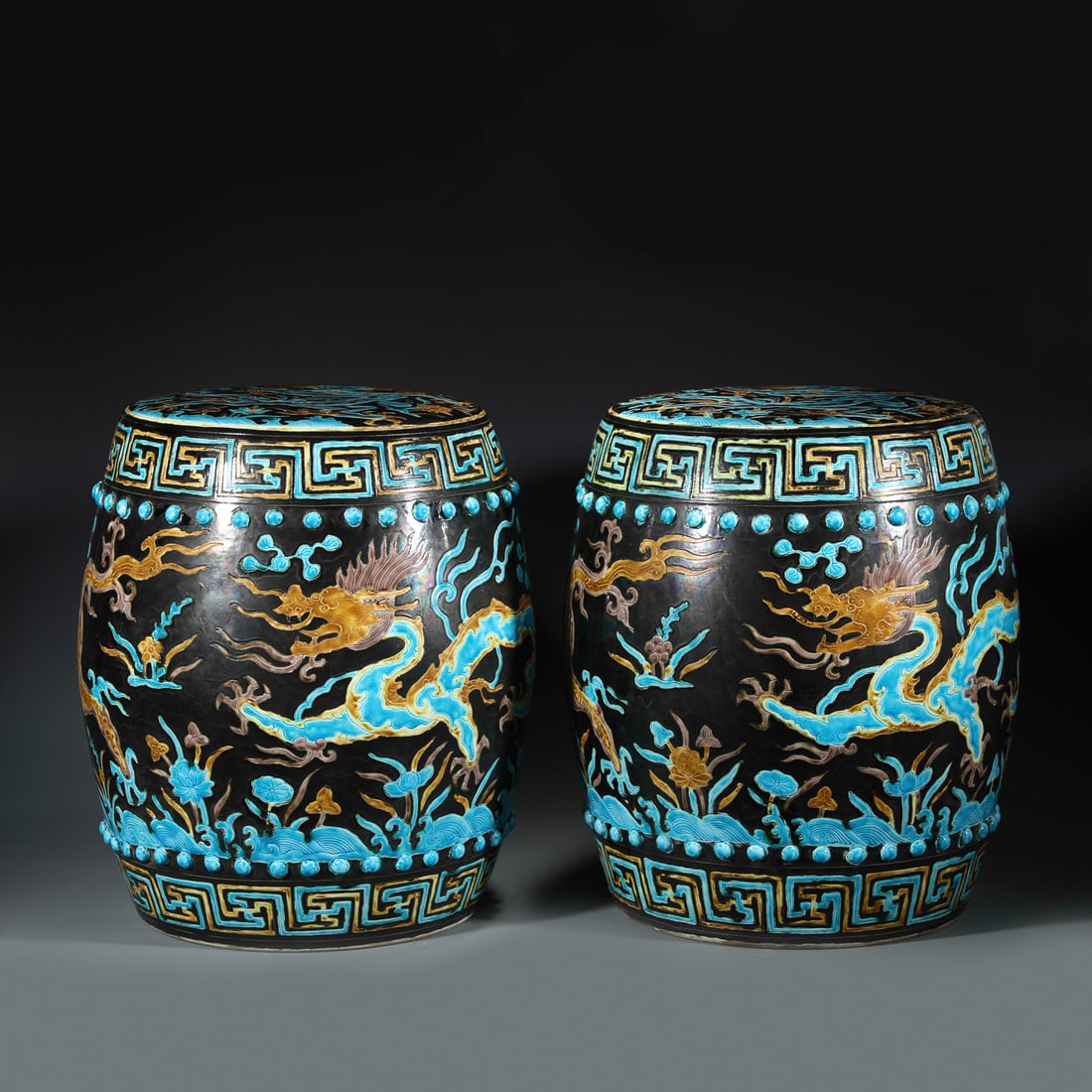 PAIR MING FAHUA COLOR DRUM STOOLS: Dimensions: Width: 38cm, Height: 43cm Pair Of Chinese Ming Dynasty Fahua Color Porcelain Drum Stools. Potted into cylindrical body, heavy on the mid, round mouth lip with flat dome, raised with round