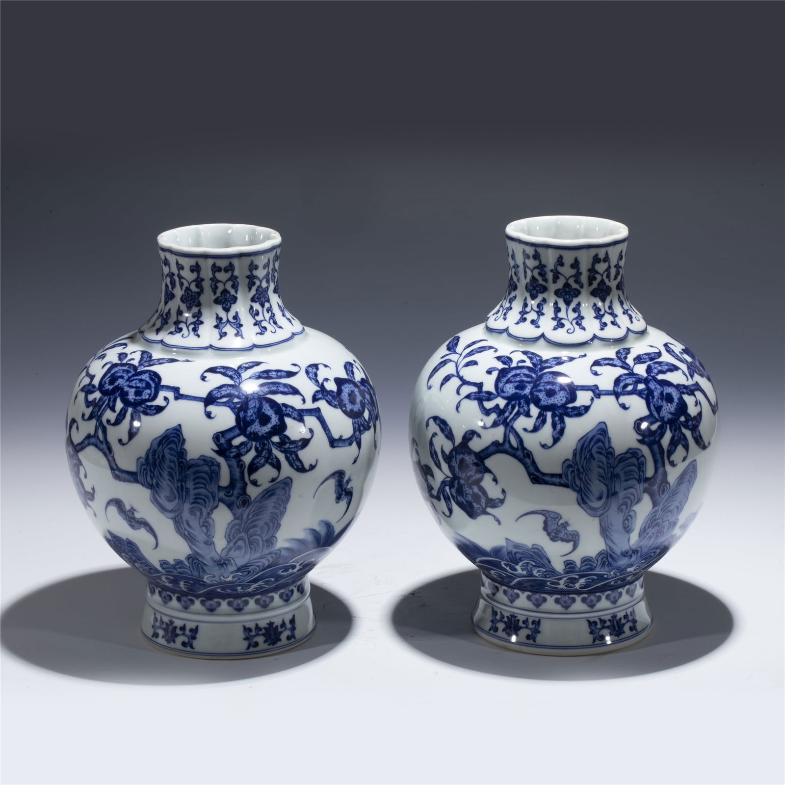 PAIR OF QING YONGZHENG BLUE VASES: Dimensions: length: 19 cm, Width: 19 cm, Height: 25 cm Pair of Chinese Qing Dynasty Yongzheng Blue and White Pomegranate Porcelain Bottle Vases. Potted in bottle shape vase, thick and small, globular