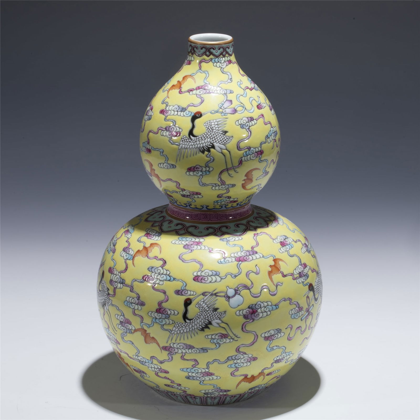 QING QIANLONG FAMILLE ROSE GOURD VASE: Dimensions: length: 18 cm, Width: 18 cm, Height: 28. 7 cm Chinese Qing Dynasty Qianlong Famille Rose Fu Bats Porcelain Gourd Bottle Vase. Potted in a shape of double gourd resemblance, with two bulbou