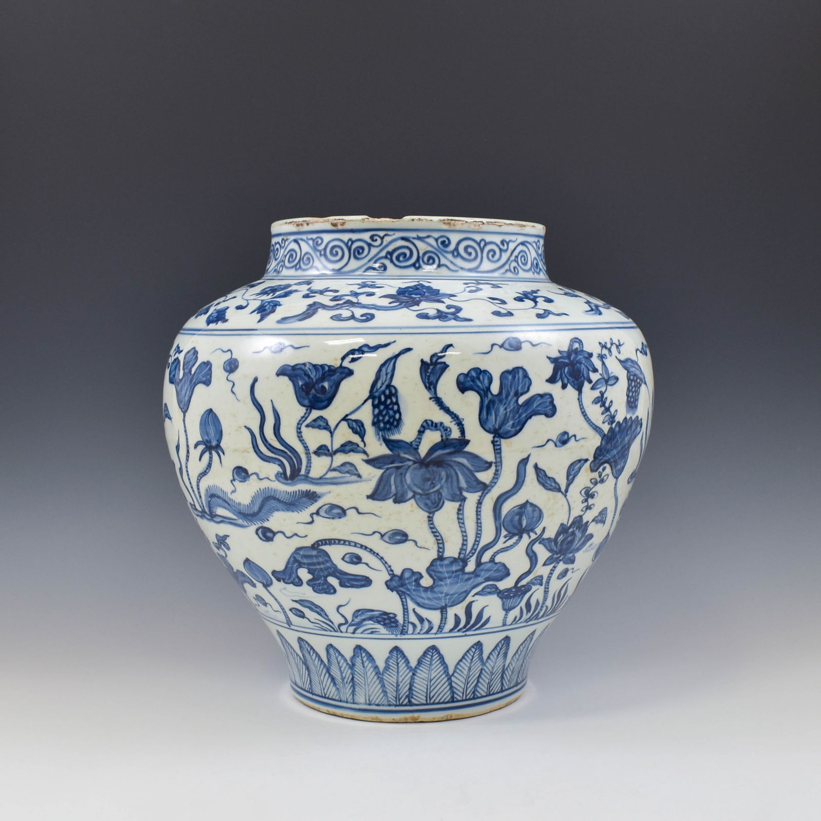 MING BLUE & WHITE LOTUS POND JAR: Dimensions: 15. 75" H x 15" W Chinese Ming Dynasty Period, blue & white lotus pond motif porcelain jar. The porcelain potted in jar shape, having large and thick potted body, sturdily potted in a bulb