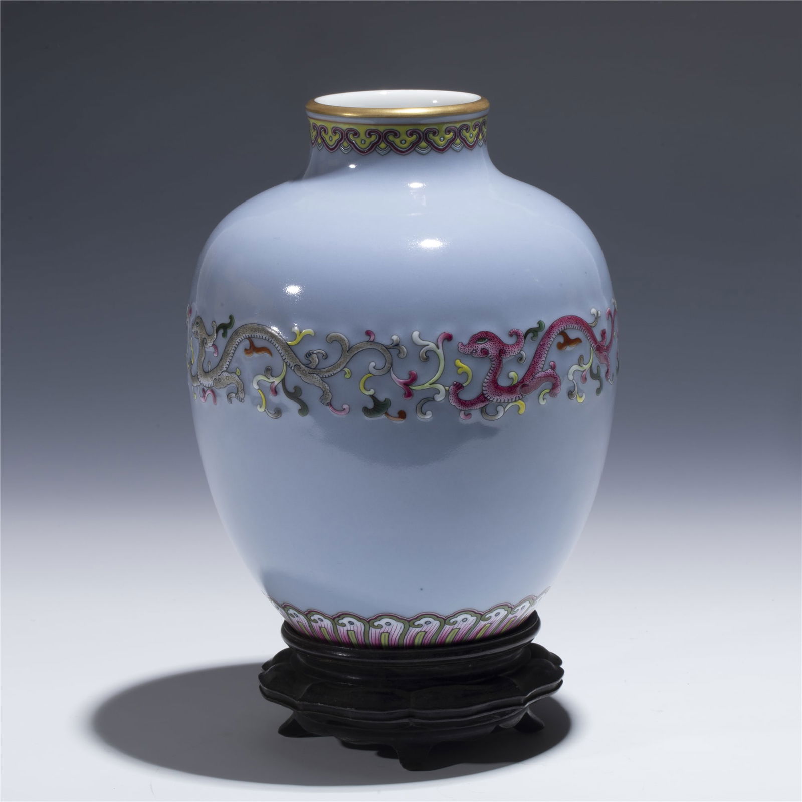 QING JIAQING FAMILLE ROSE LANTERN BOTTLE: Dimensions: length: 14. 3 cm, Width: 14. 3 cm, Height: 18 cm Chinese Qing Dynasty Jiaqing Famille Rose Porcelain Lantern Bottle On Hardwood Stand. Potted in bottle shape vase, globular lower body, ovo