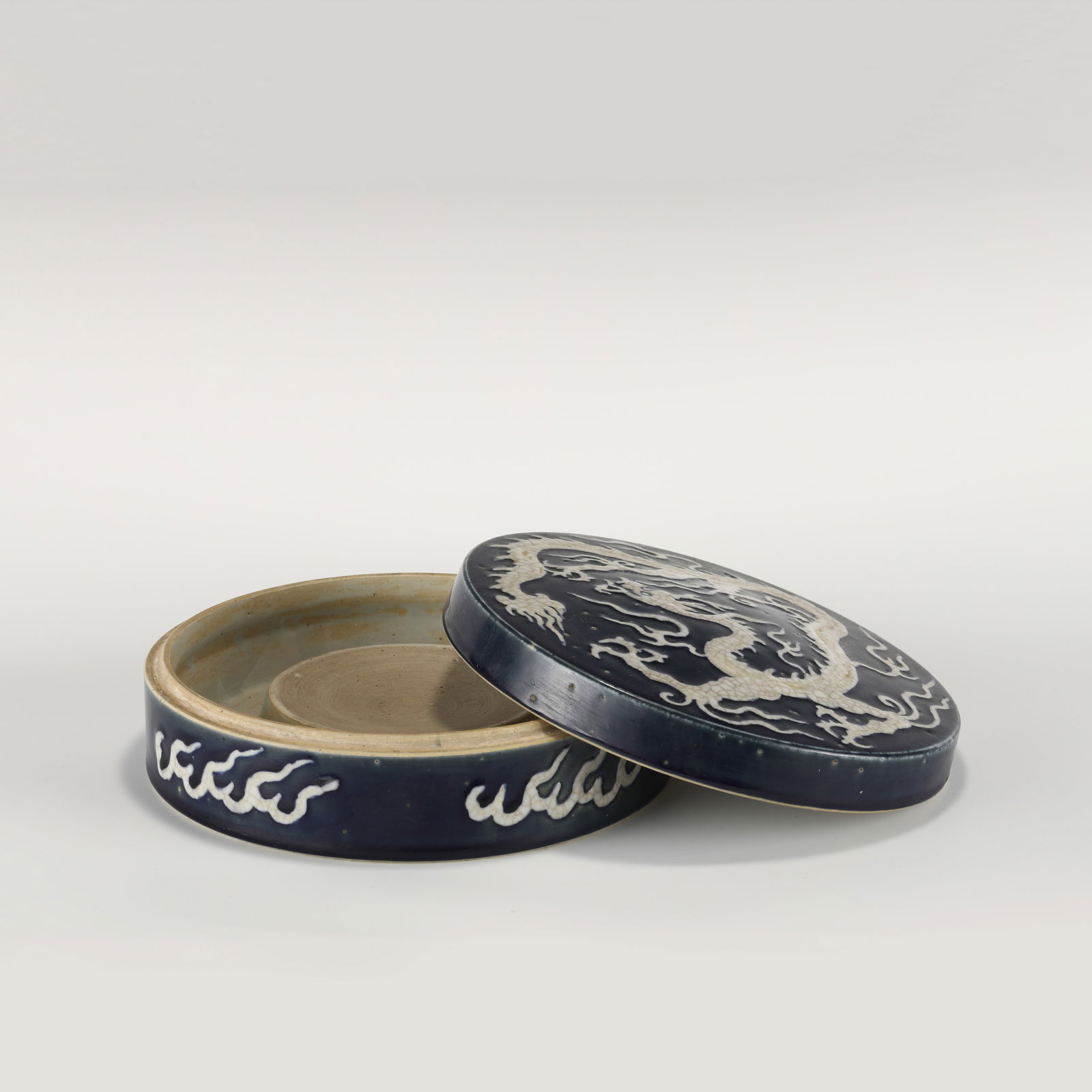 Ming Blue Glazed White Dragon Chaozhu Box: Dimensions: Height: 8cm, Diam: 23cm Chinese Ming Dynasty Blue and White Dragon Porcelain Chaozhou Box. Potted unto a slightly flattened round box, correspondence rectangle lid, raised from rounded sid