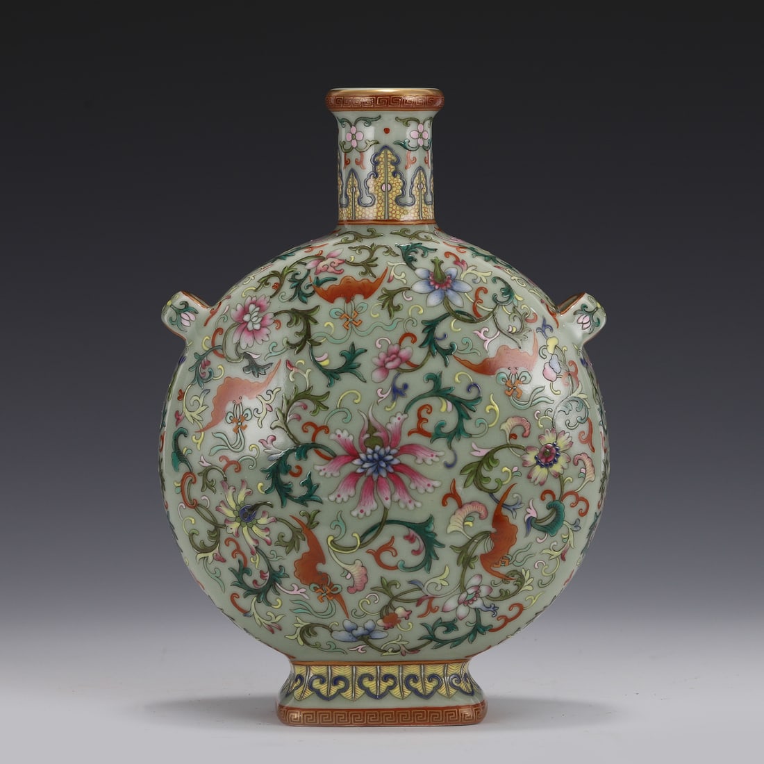 QING FAMILLE ROSE MOON FLASK, QIANLONG MARK: Dimensions: Height: 23.5, Length: 17 cm, Width: 9 cm Chinese Qing Famille Rose Auspicious Floral Motif on Pale Green Ground Glazed Porcelain Moon Flask, Qianlong Mark.