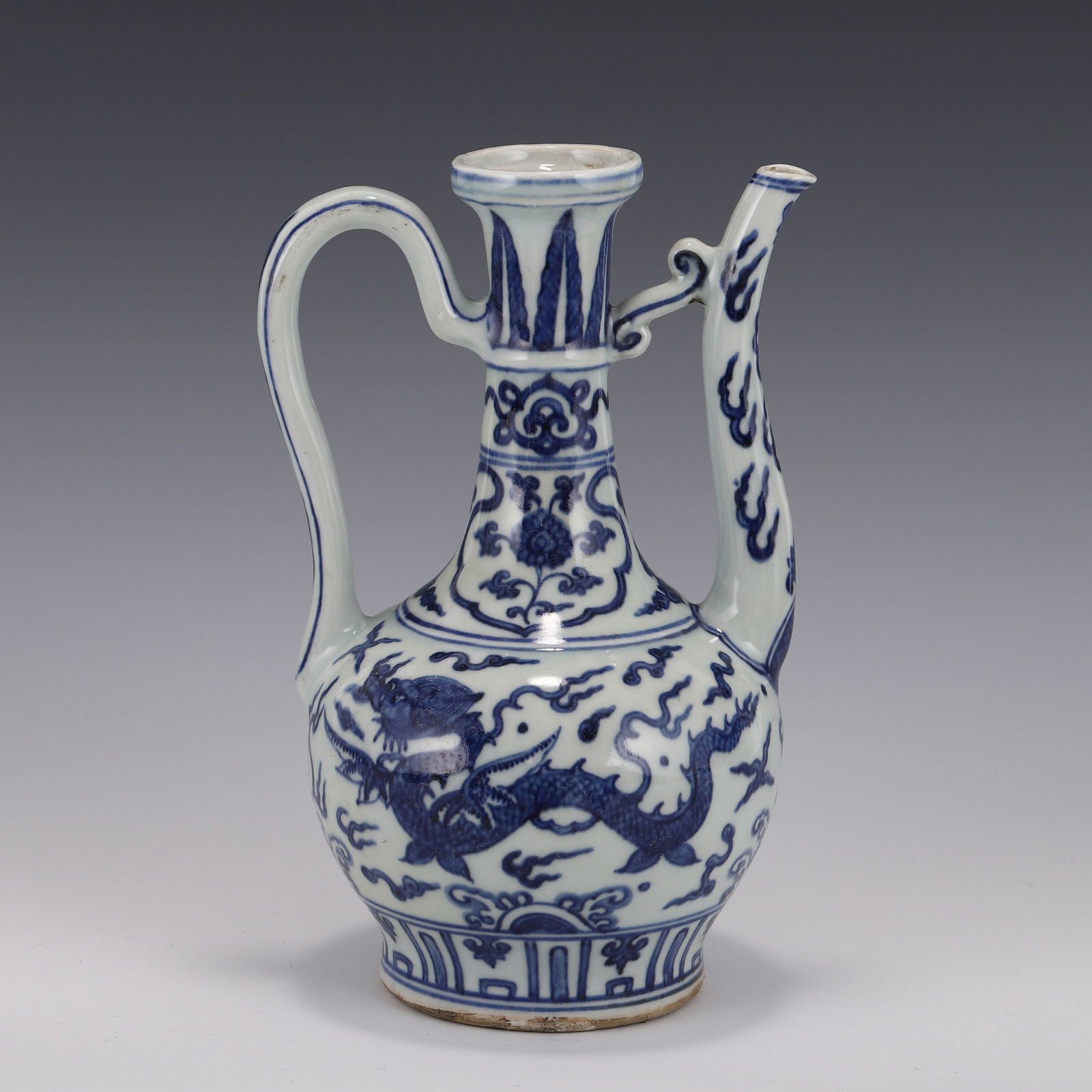 MING BLUE & WHITE DRAGON PORCELAIN EWER: Dimensions: Height: 24 cm, Length: 16cm, Width: 14cm Chinese Ming Dynasty Period, Blue and white Dragon porcelain ewer. Potted in tea spout shape, thick, globular lower body, curved spout flanked on t