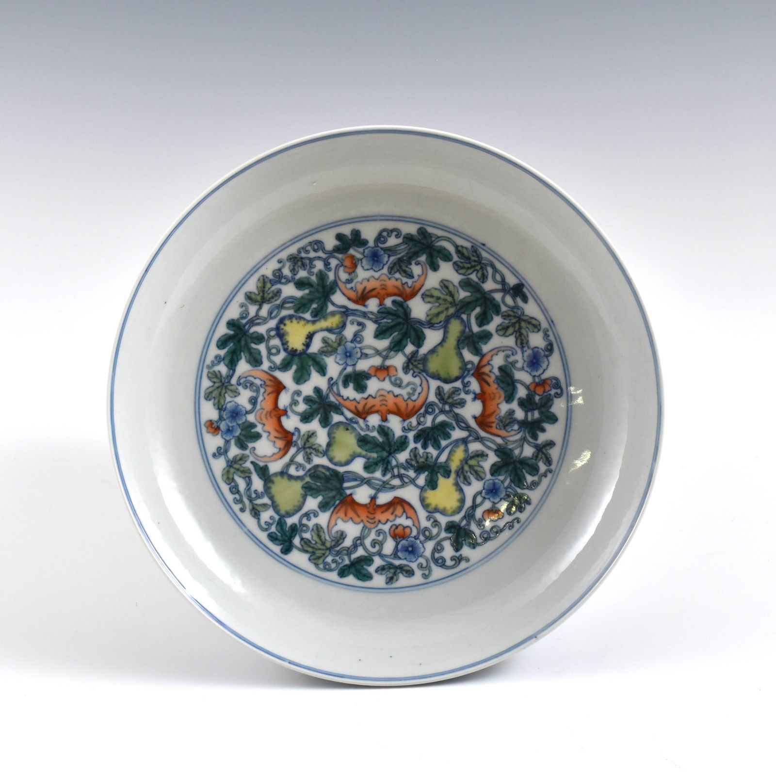 YONGZHENG DOUCAI FU BAT WRAPPED FLORAL PORCELAIN PLATE: Dimensions: 1-7/8" H x 8-7/8" Dia. Chinese Qing Dynasty Period, Doucai Fu Bat wrapped floral porcelain plate. Potted in shallow vessel form, thick and large, with broad wide central interior, rounded