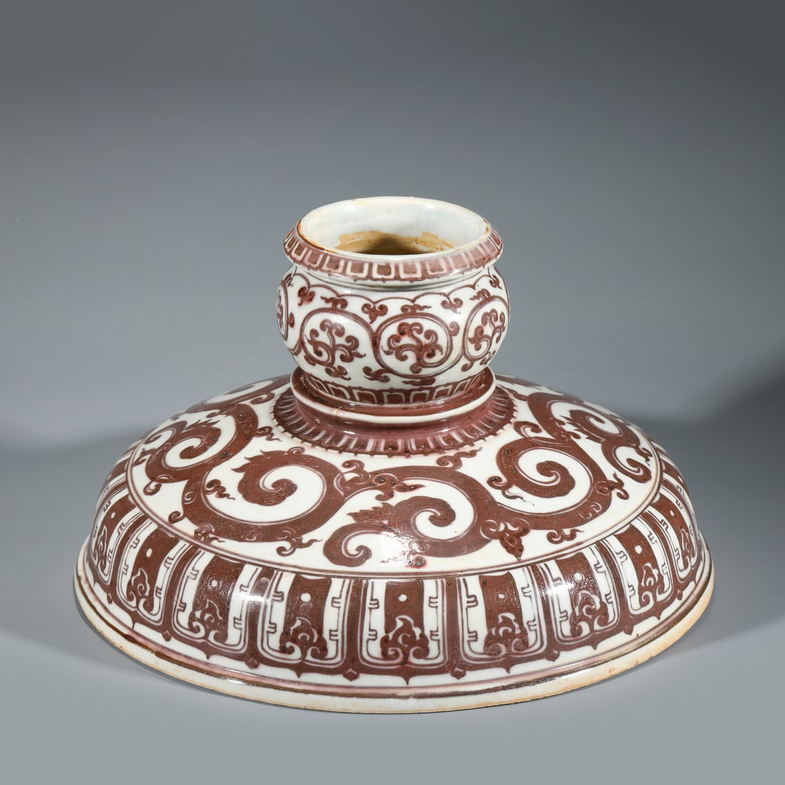 MING UNDERGLAZED RED PORCELAIN HAT STAND: Dimensions: Width: 31.5cm, Height: 21.5cm Chinese Ming Dynasty Red and White Porcelain Hat Stand. The porcelain potted in pot shape, half moon body, short cylindrical neck with close mouth rim, raised