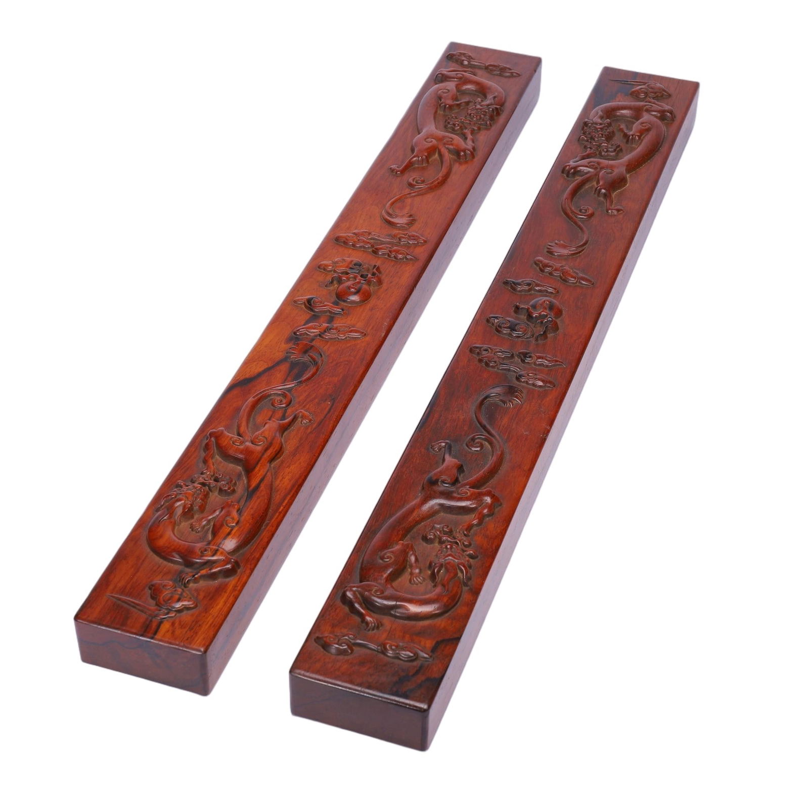 CHINESE HUANGHUALI JADE-INLAID RUYI SCEPTER: Dimensions: L. 60 cm. This elegant Chinese ruyi scepter is crafted from richly grained huanghuali wood, with its head inlaid with a carved jade plaque depicting auspicious motifs. The long,