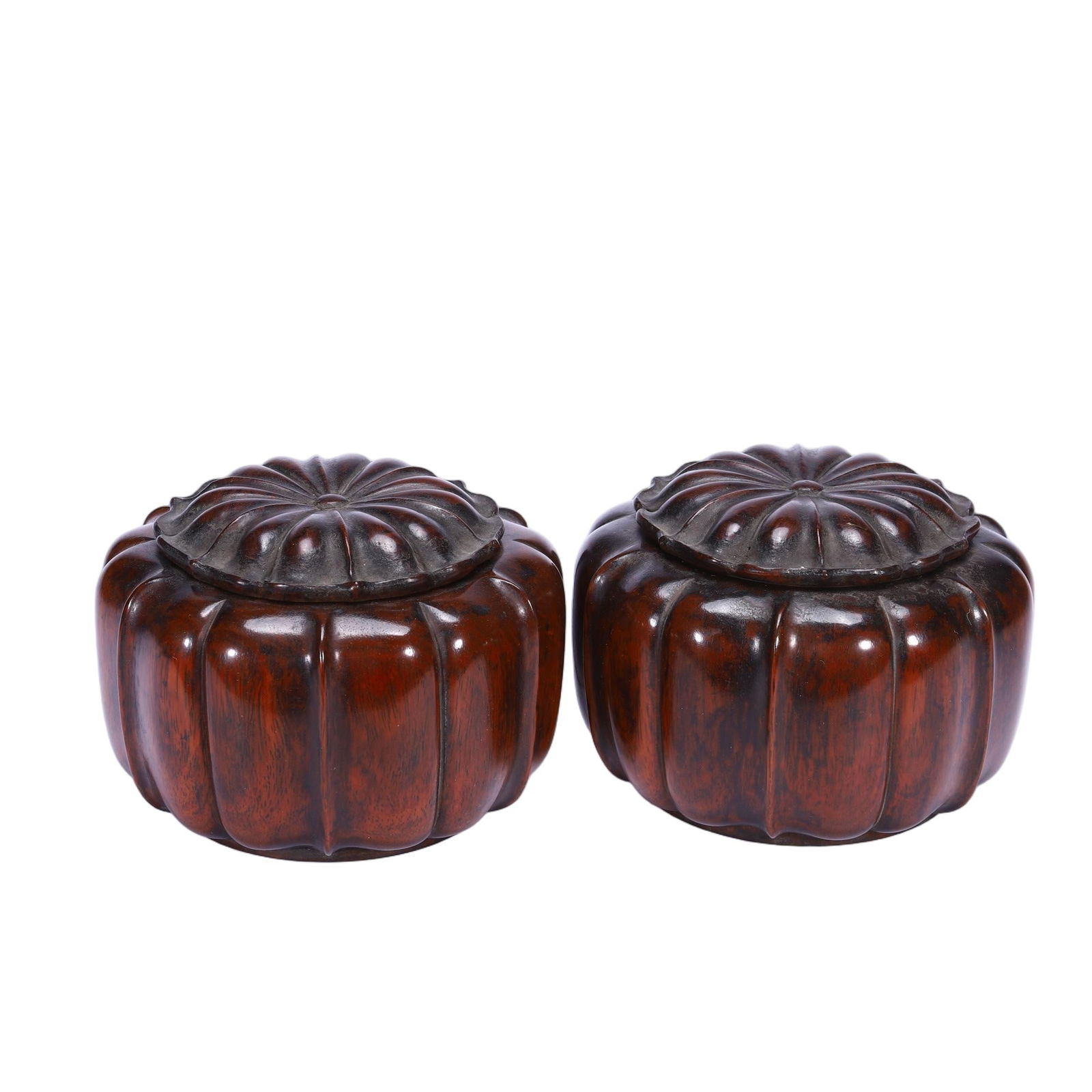 CHINESE HUANGHUALI MELON BOXES: Dimensions: L. 12 cm. W. 12 cm. H. 8 cm. Weight 470 grams. This elegant pair of Chinese huanghuali boxes is carved in the form of ripe melons, with deeply ribbed bodies and petal-shaped lids that