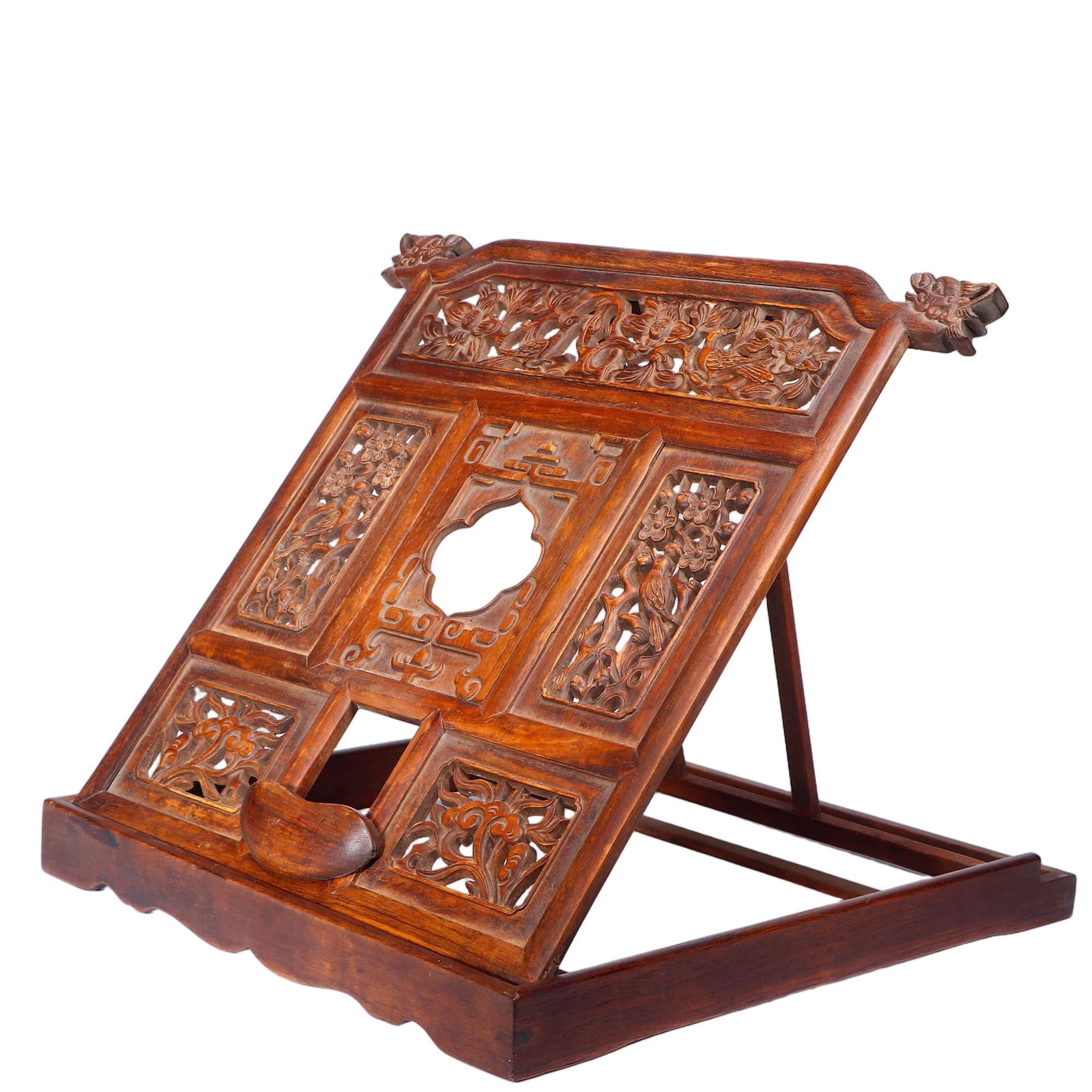 CHINESE HUANGHUALI MIRROR STAND: Dimensions: L. 39 cm. W. 38 cm. This elegant Chinese mirror stand is crafted from warm, lustrous huanghuali wood, featuring an adjustable, slanted frame with intricate openwork carvings of floral and