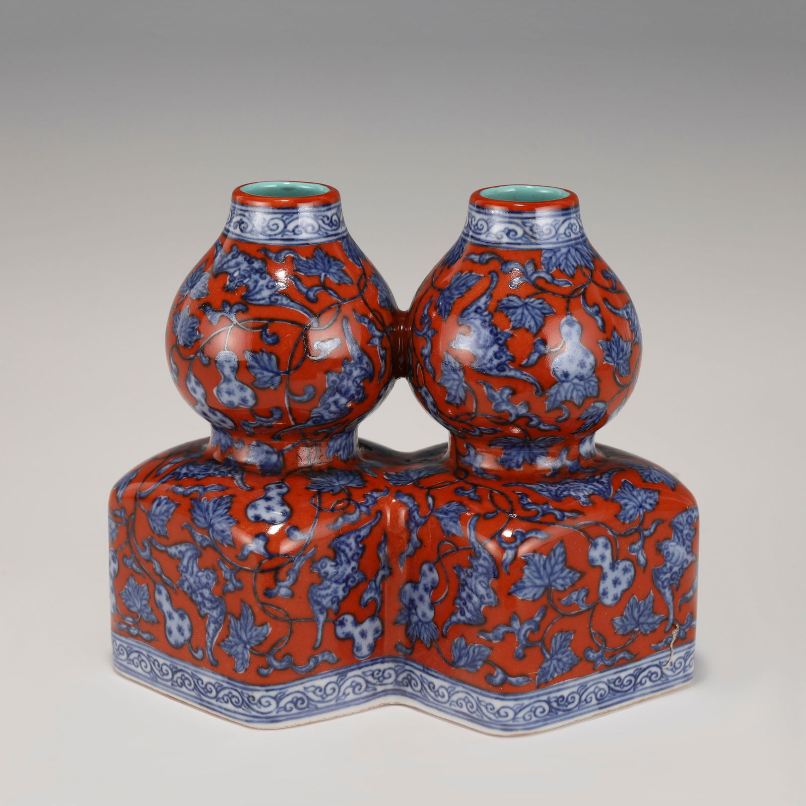 QING QIANLONG DOUBLE BOTTLE: Dimensions: Length: 17 Width: 11cm, Height: 15cm Chinese Qing Dynasty Qianlong Blue and Alum Red Porcelain Double Gourd Vase. The porcelain potted in a shape of double gourd bottle vase conjoined in u