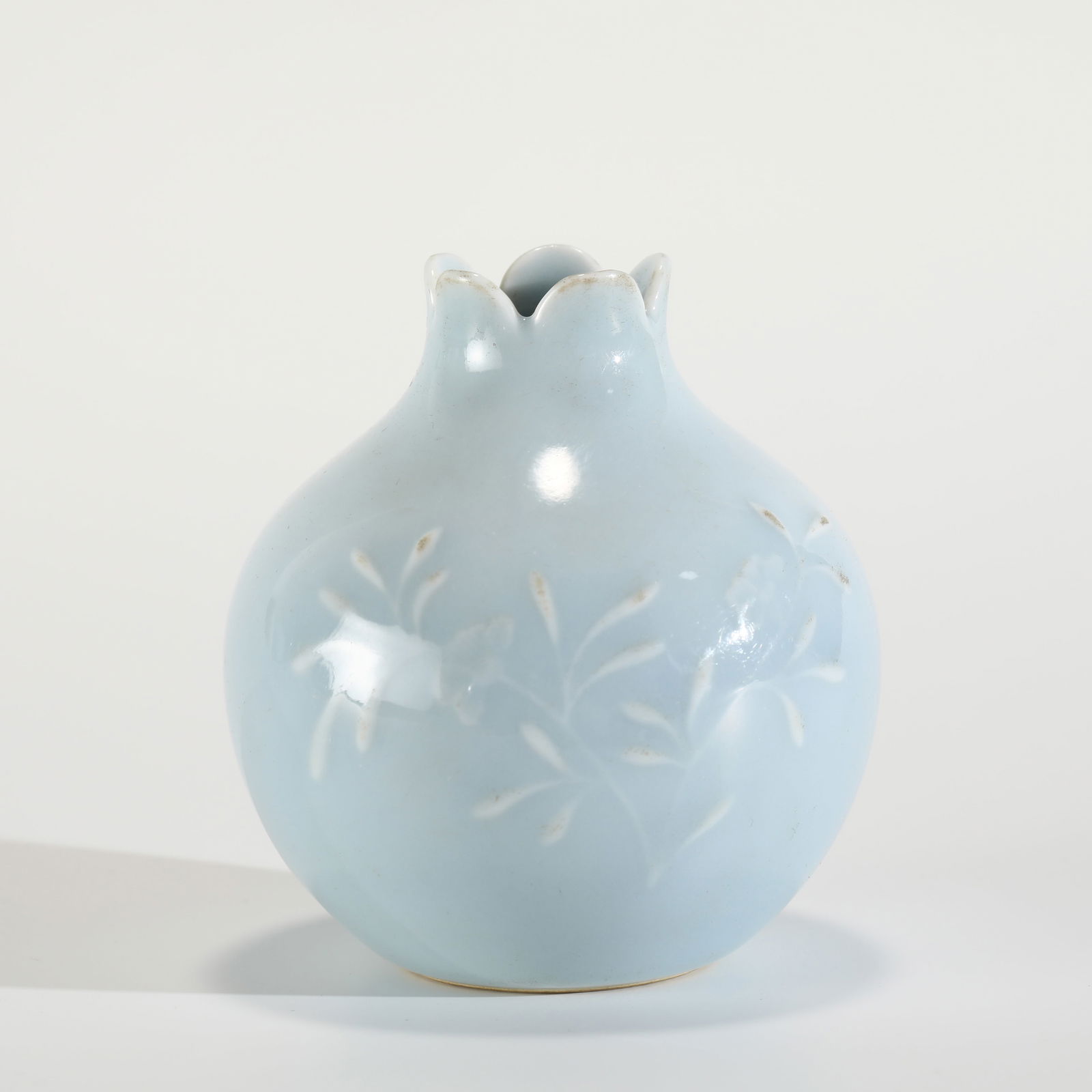 QING DAOGUANG SKY BLUE GLAZED POMEGRANATE WATER POT: PROVENANCE: From Celina, TX Private Collector. Dimensions: Height: 8.5 cm,cm, Diameter: 7.9 cm Chinese Qing Dynasty DaoGuang Sky Blue Glazed Porcelain Pomegranate Water Pot. Potted unto small vessel