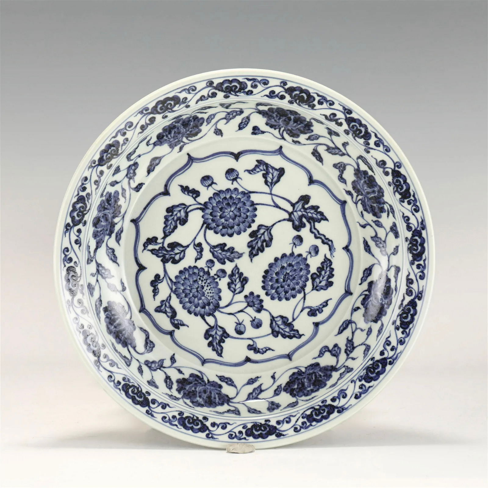 MING BLUE & WHITE LOTUS PLATE: PROVENANCE: From private collectors in Gables Estates, Miami, Florida. Measurements: Height: 6.8 cm, Diam: 39.7cm Chinese Ming Dynasty Blue and White Lotus Porcelain Plate. The plates has a broad wide