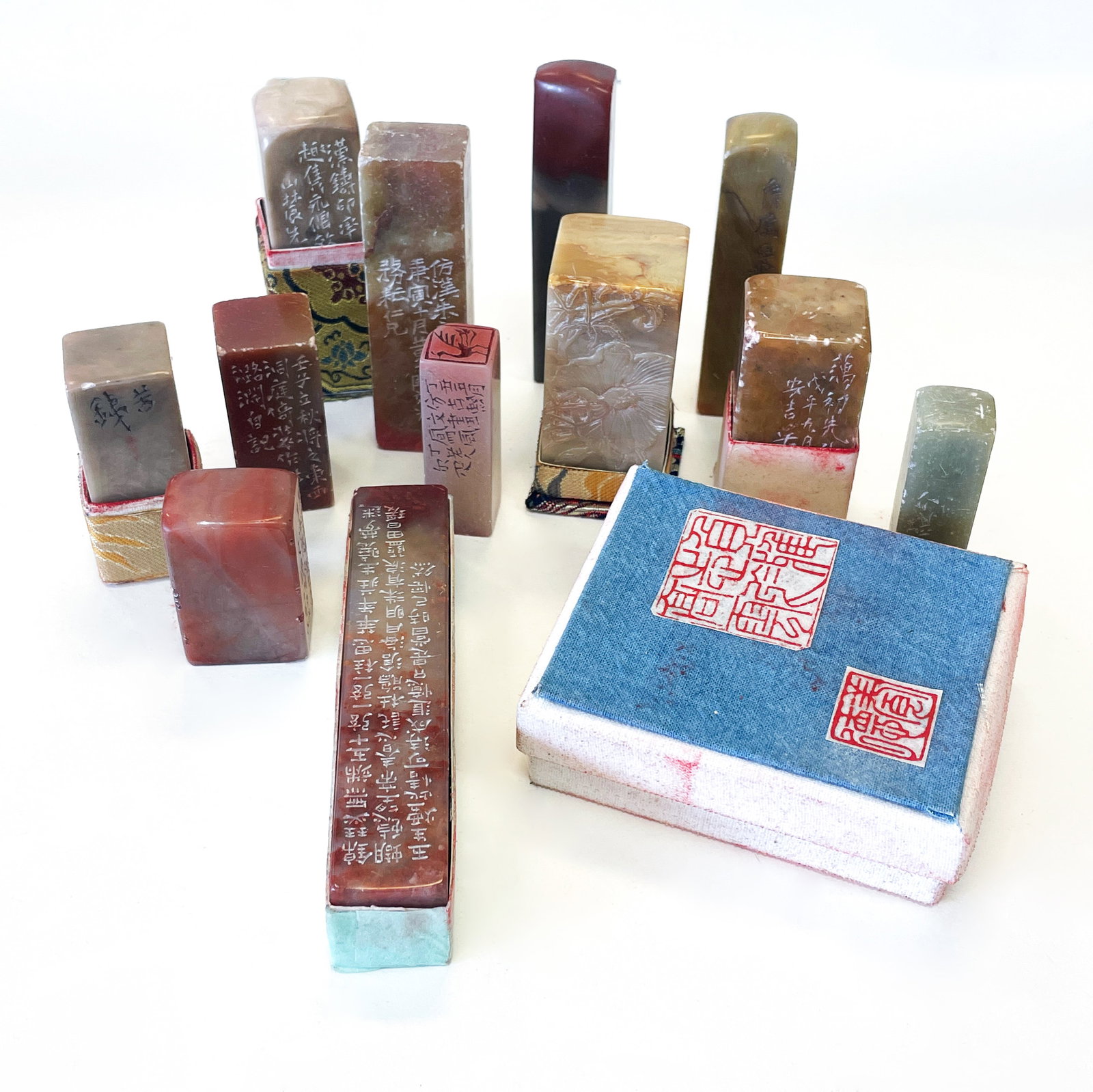 A GROUP OF 14 CHINESE SCHOLARS SEAL STONES: A Group of 14 pcs Chinese Scholars Seal StonesA varied assemblage of over thirty carved seal stones in Shoushan, Qingtian, Balin, and mixed agate materials. Each piece inscribed in seal or clerical sc