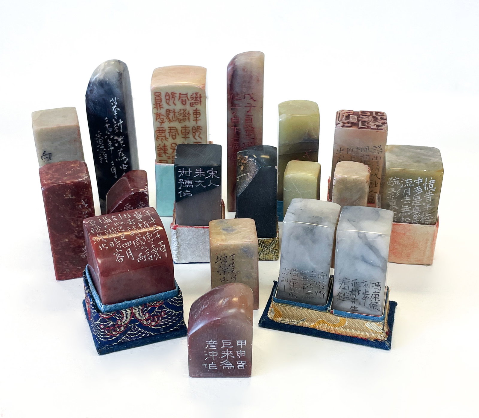 A GROUP OF 18 CHINESE SCHOLARS SEAL STONES: A Group of 18 pcs Chinese Scholars Seal StonesA varied assemblage of over thirty carved seal stones in Shoushan, Qingtian, Balin, and mixed agate materials. Each piece inscribed in seal or clerical sc