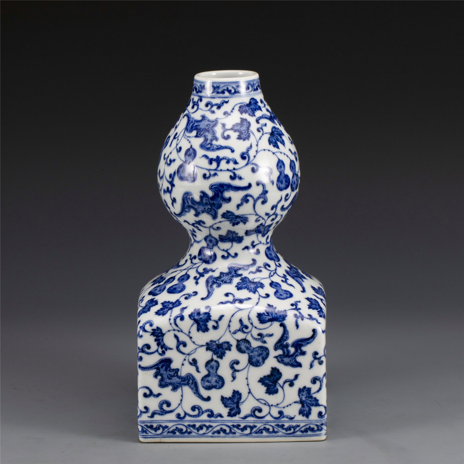 QIABLONG BLUE & WHITE SQUARED GOURD VASE: Dimensions: Length: 16.5cm, Width: 16.5cm, Height: 31.3cm. Chinese Qing Dynasty Qianlong Blue and White Bat and Gourd Tianyuan Squared Gourd Vase. The Chinese porcelain potted in a shape of squared do