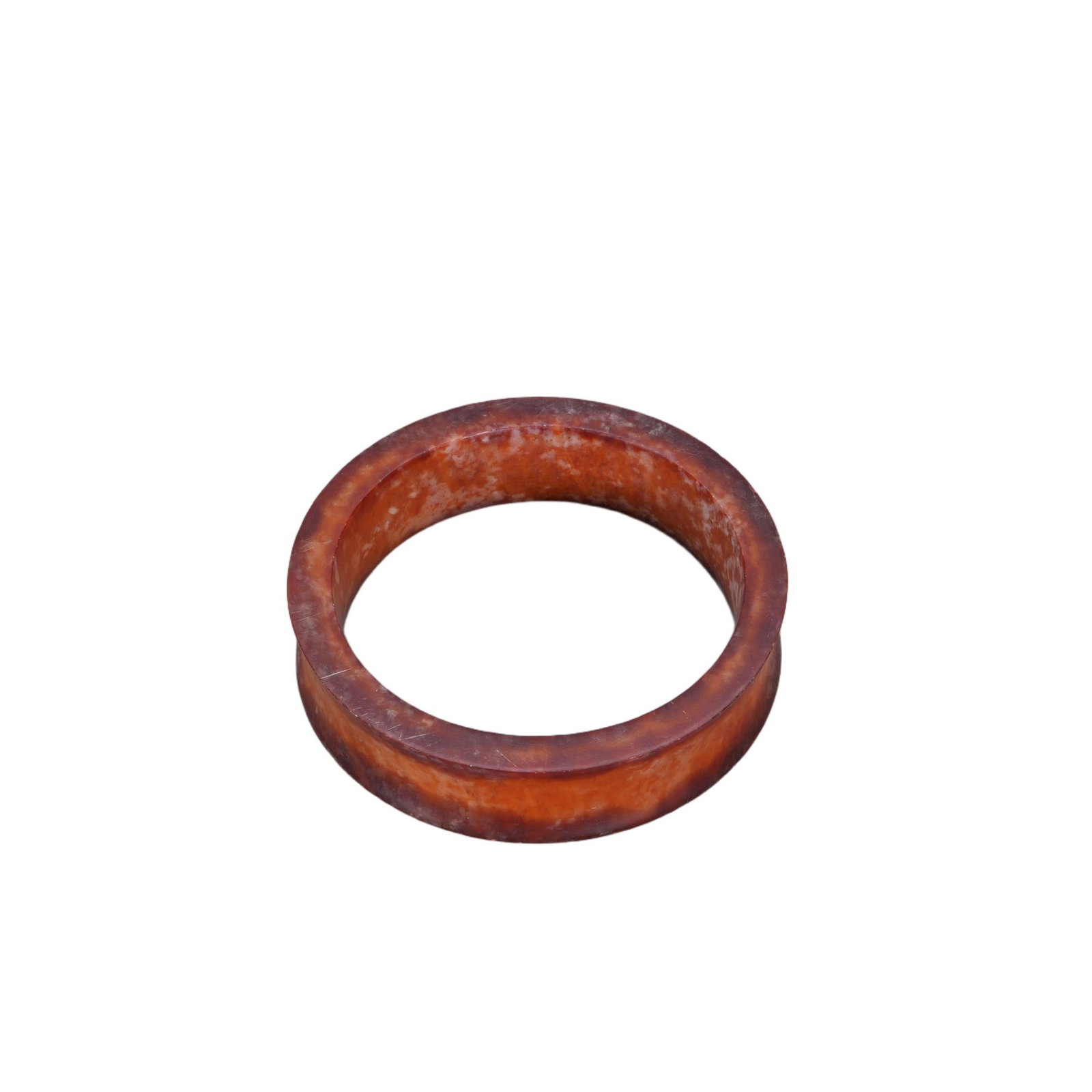 A CHINESE LIANGZHU CULTURE JADE BANGLE: This wide flat tubular jade bangle boasts a thick rectangular cross-section, fully polished to smooth surfaces both inside and out. The stone is permeated by rich earthy russet staining interspersed w